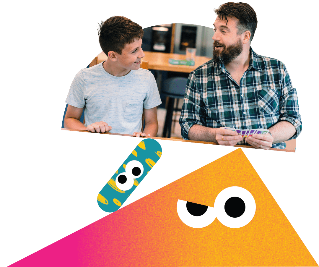 A father and son playing a card game together.
