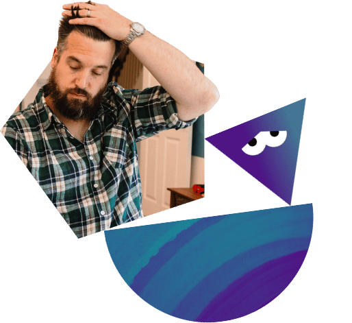 A stressed man runs his fingers through his hair.