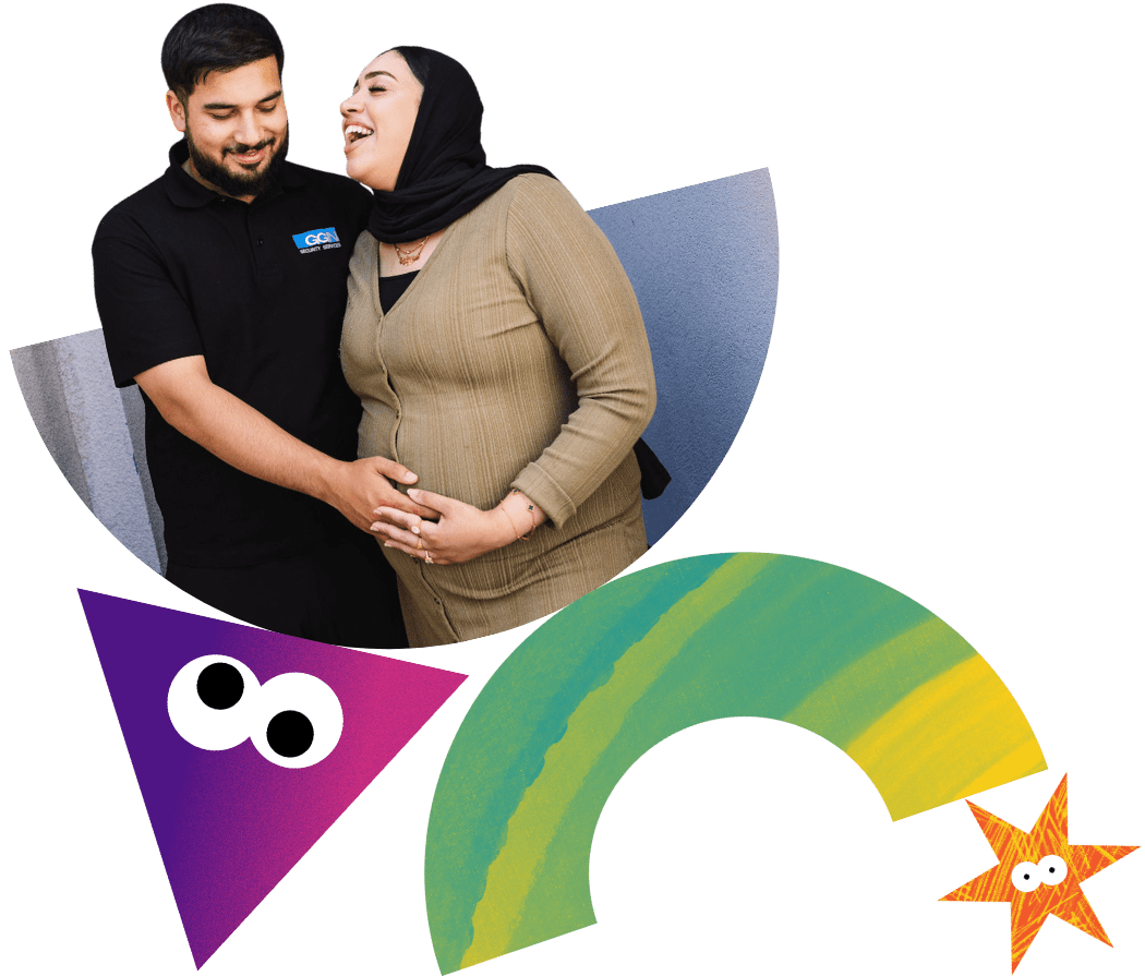 A man holding the pregnancy bump of an expectant mother.