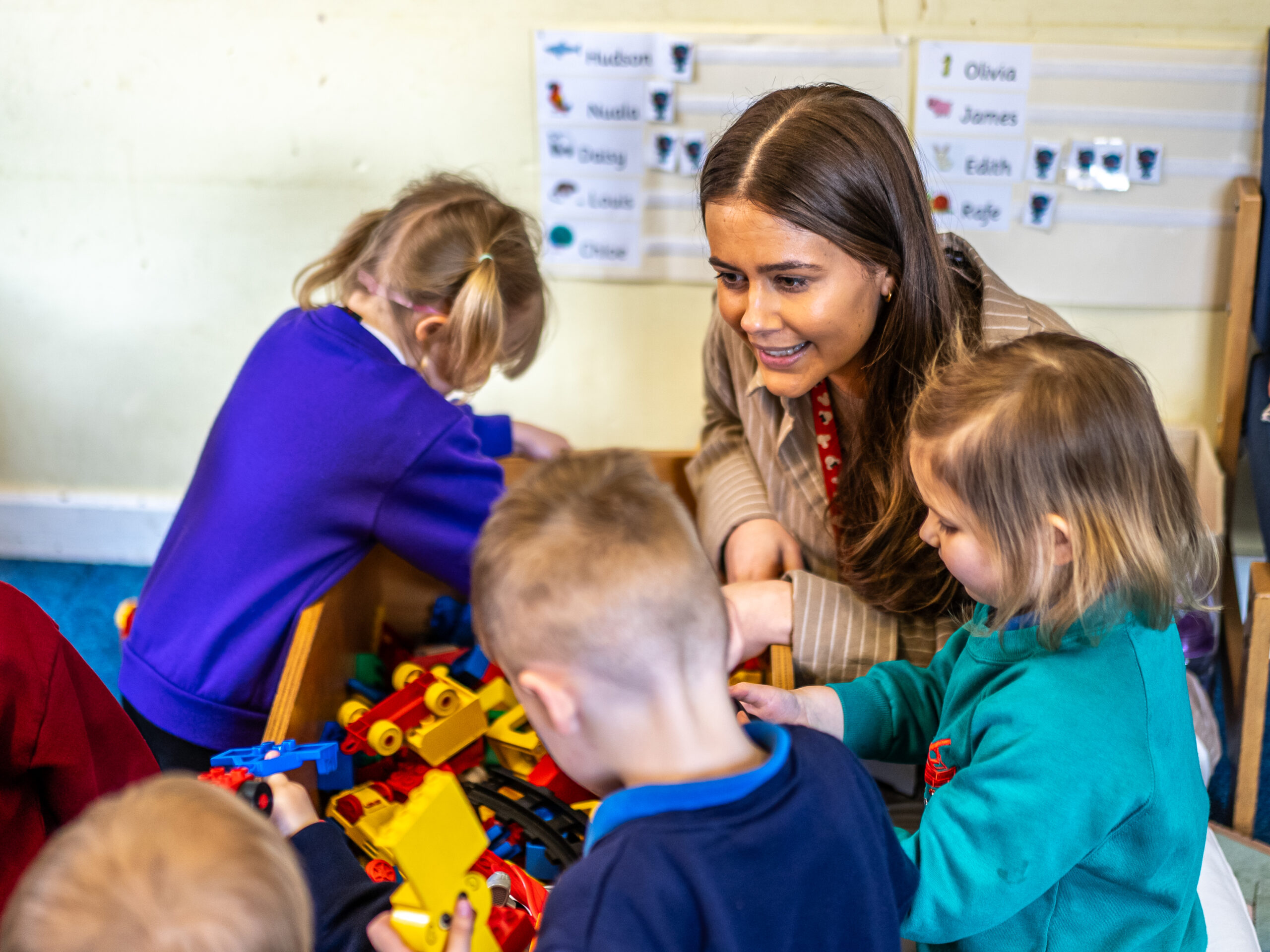 A teacher with her young students.