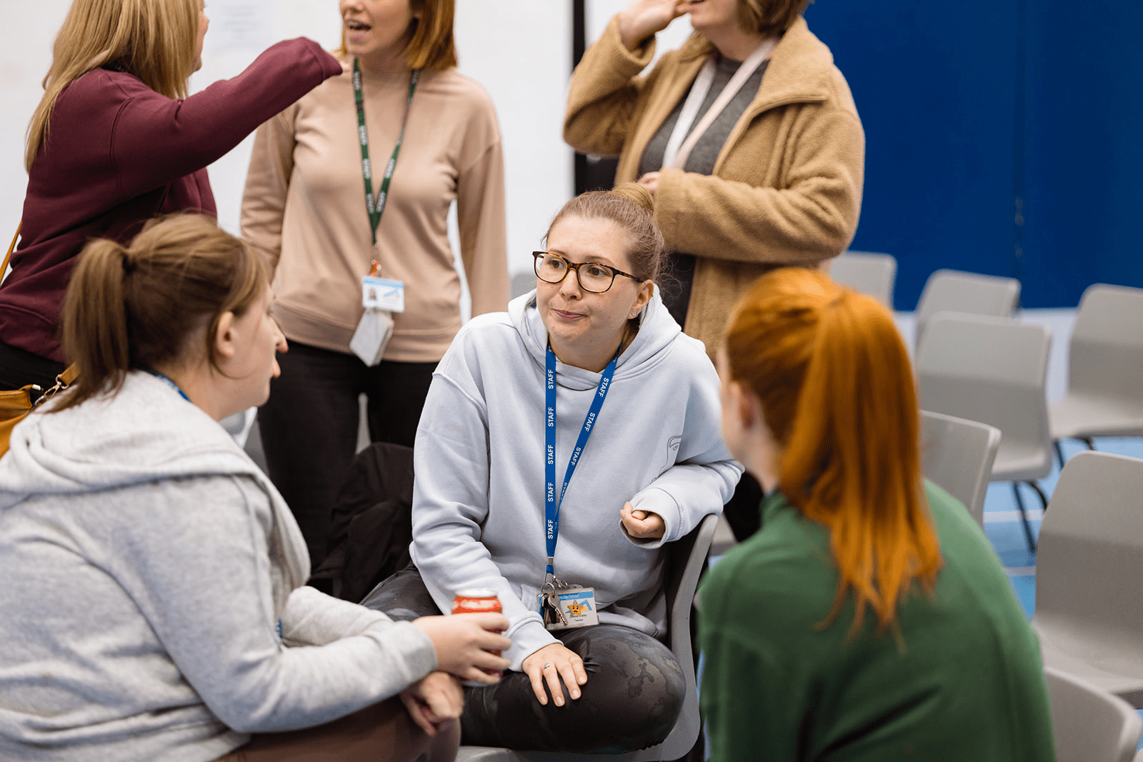 A group of colleagues in a group meeting.