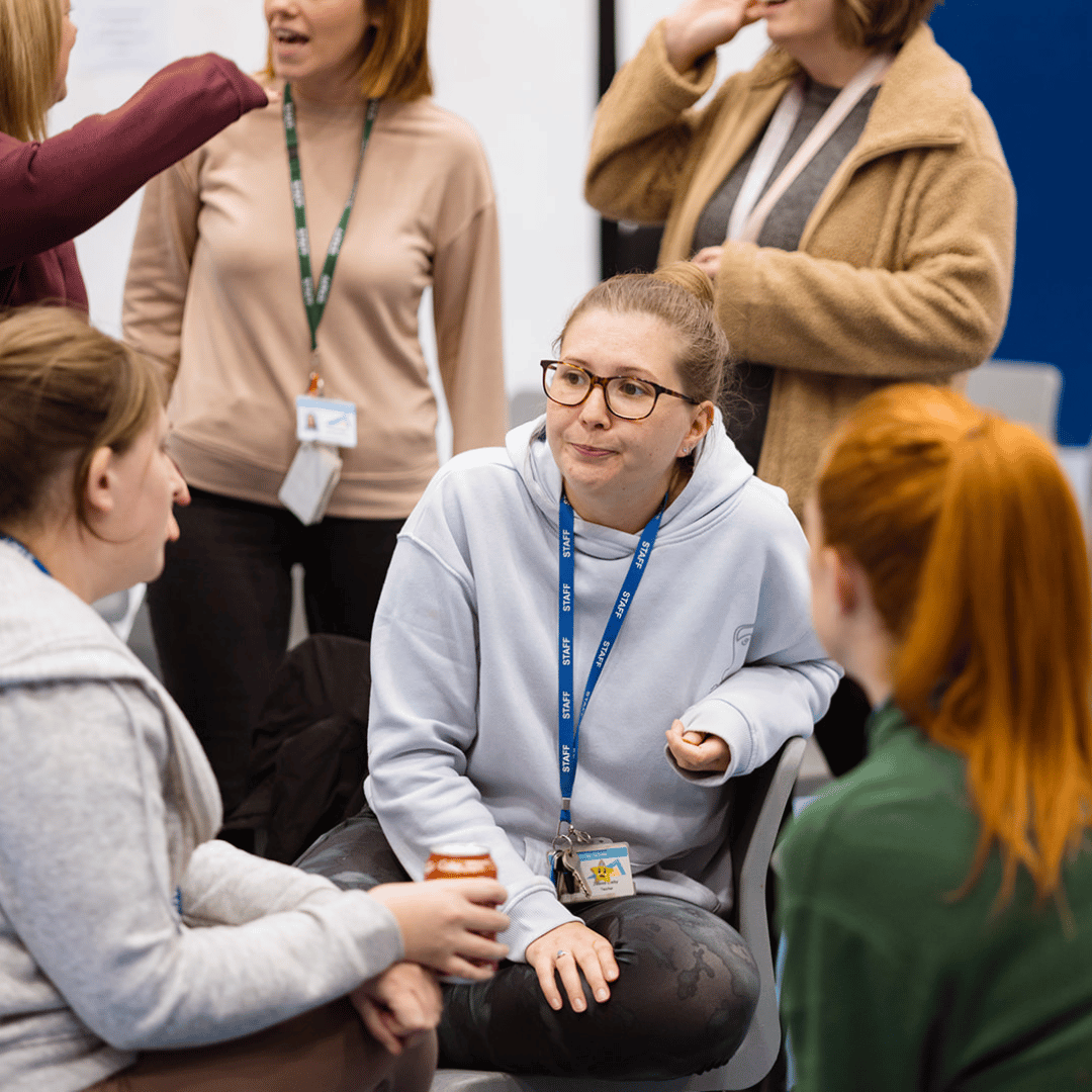 Several colleagues in a group meeting.