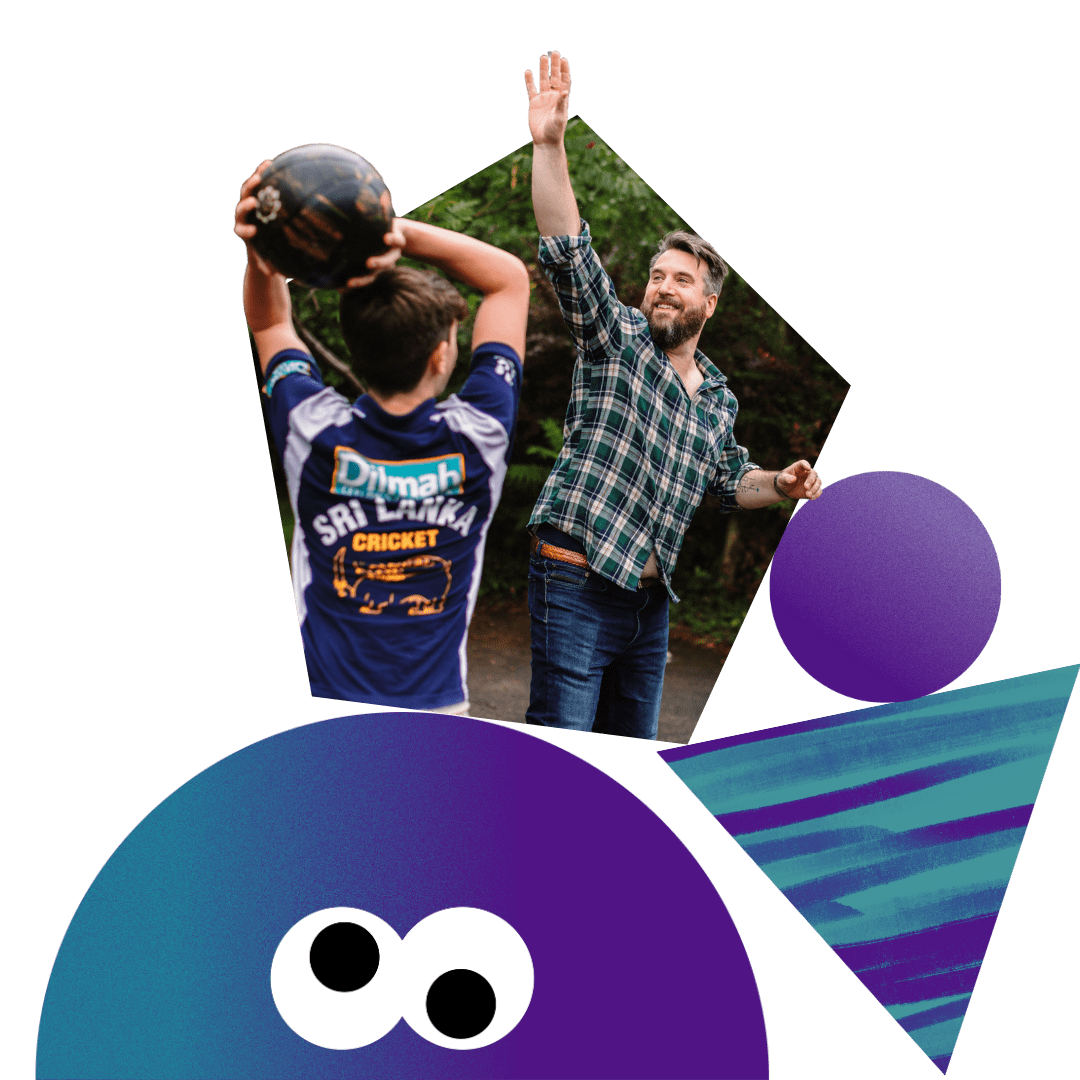 Father and son playing basketball together
