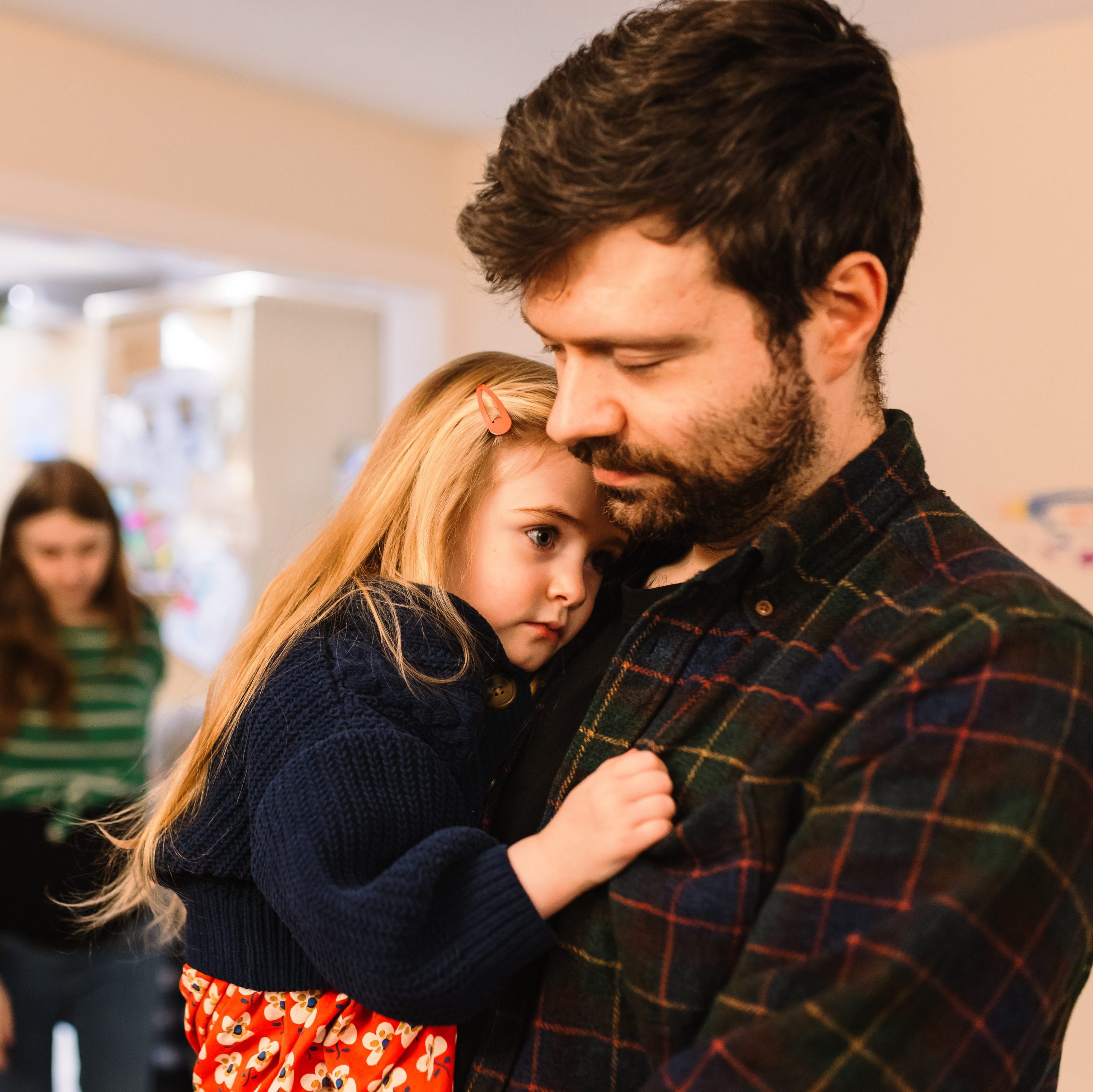 Dad giving daughter a hug